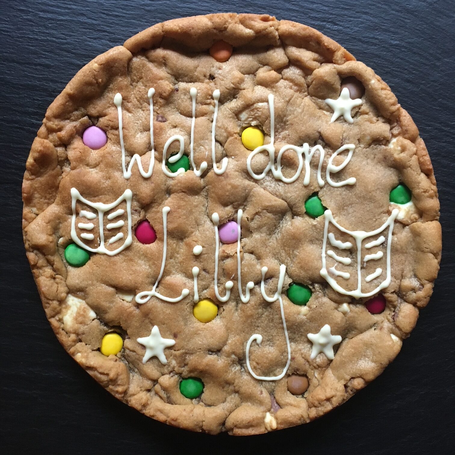 Well done giant cookie, personalised achievement gift, double chocolate with Smarties. decorated with white chocolate. gluten free